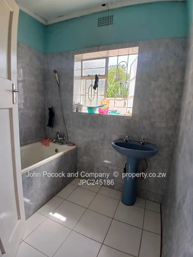 Unlock the Potential of This Well-Located Family Home!